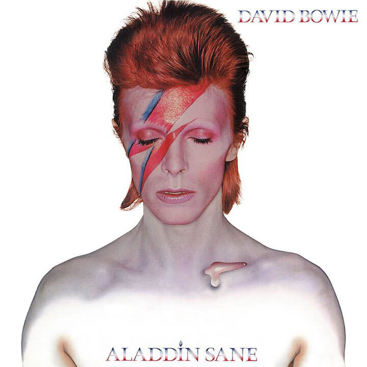 Alt text: David Bowie's 'Aladdin Sane' album cover featuring the artist with red hair and a lightning bolt face paint across his closed eyes, against a white background.