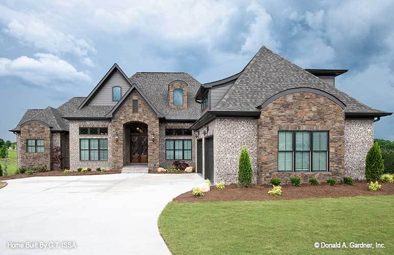 Two-Story 5-Bedroom The Hollowcrest European Inspired Home for a Sloping Lot with Courtyard Entry Garage and Bonus Room