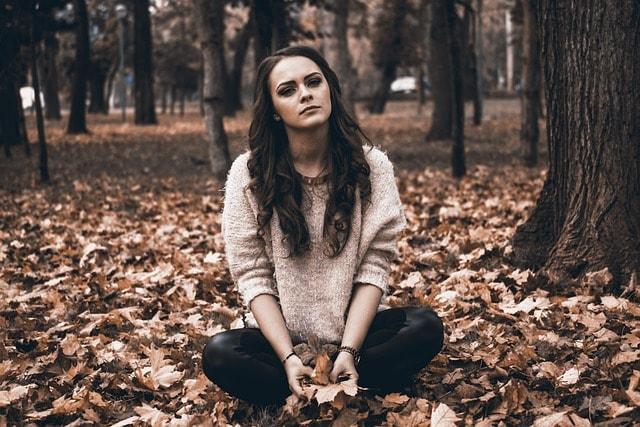 A sad girl would benefit from outpatient treatment for mental health