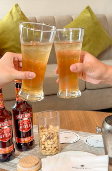 A group of hands holding glasses of liquid

AI-generated content may be incorrect.