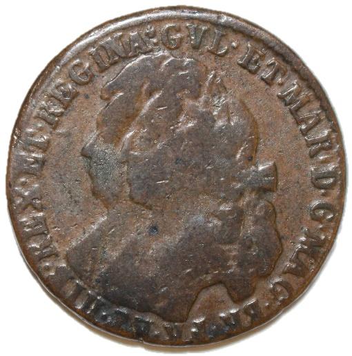 A close-up of a coin

Description automatically generated