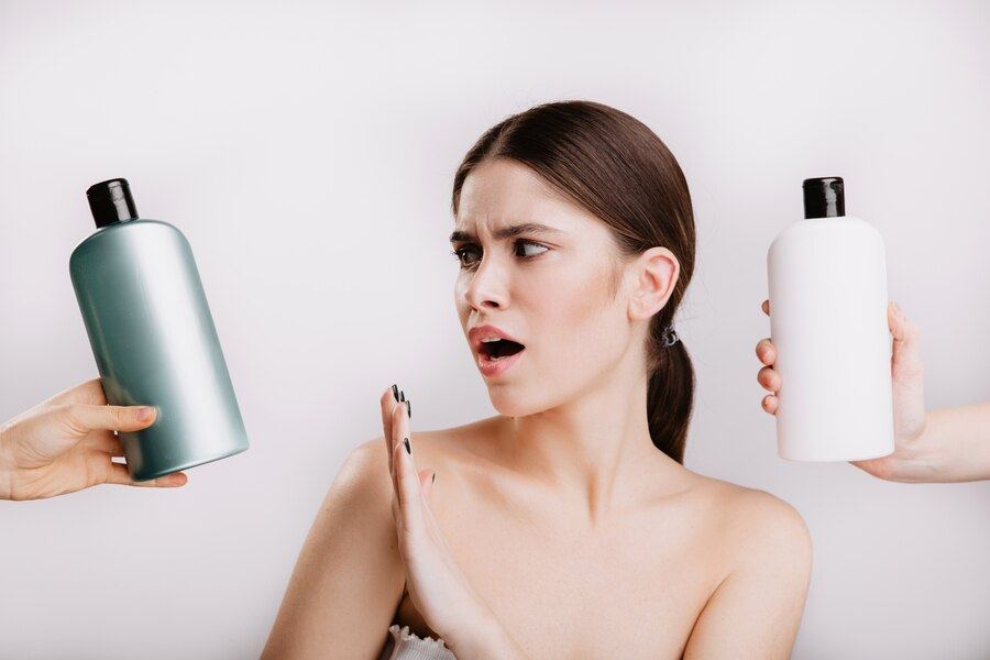 Snapshot of a girl refusing shampoo with chemicals