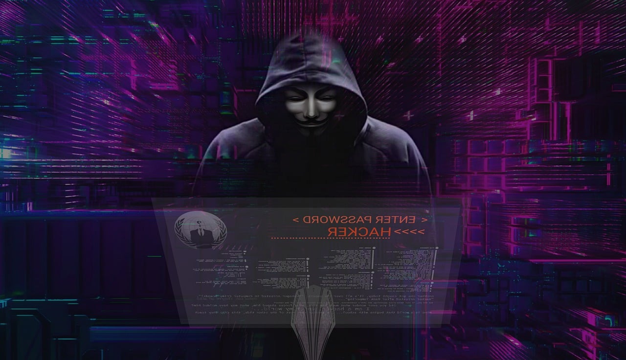 A figure in a hooded cloak, representing of the typical figure of a hacker