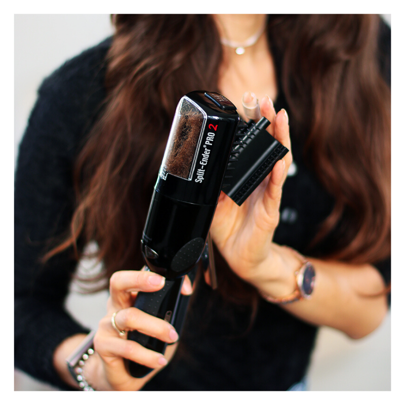 User holding the Split Ender Pro split end machine, demonstrating easy home trimming without losing hair length.
