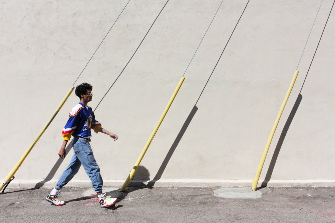 Worker painting parking lot lines
