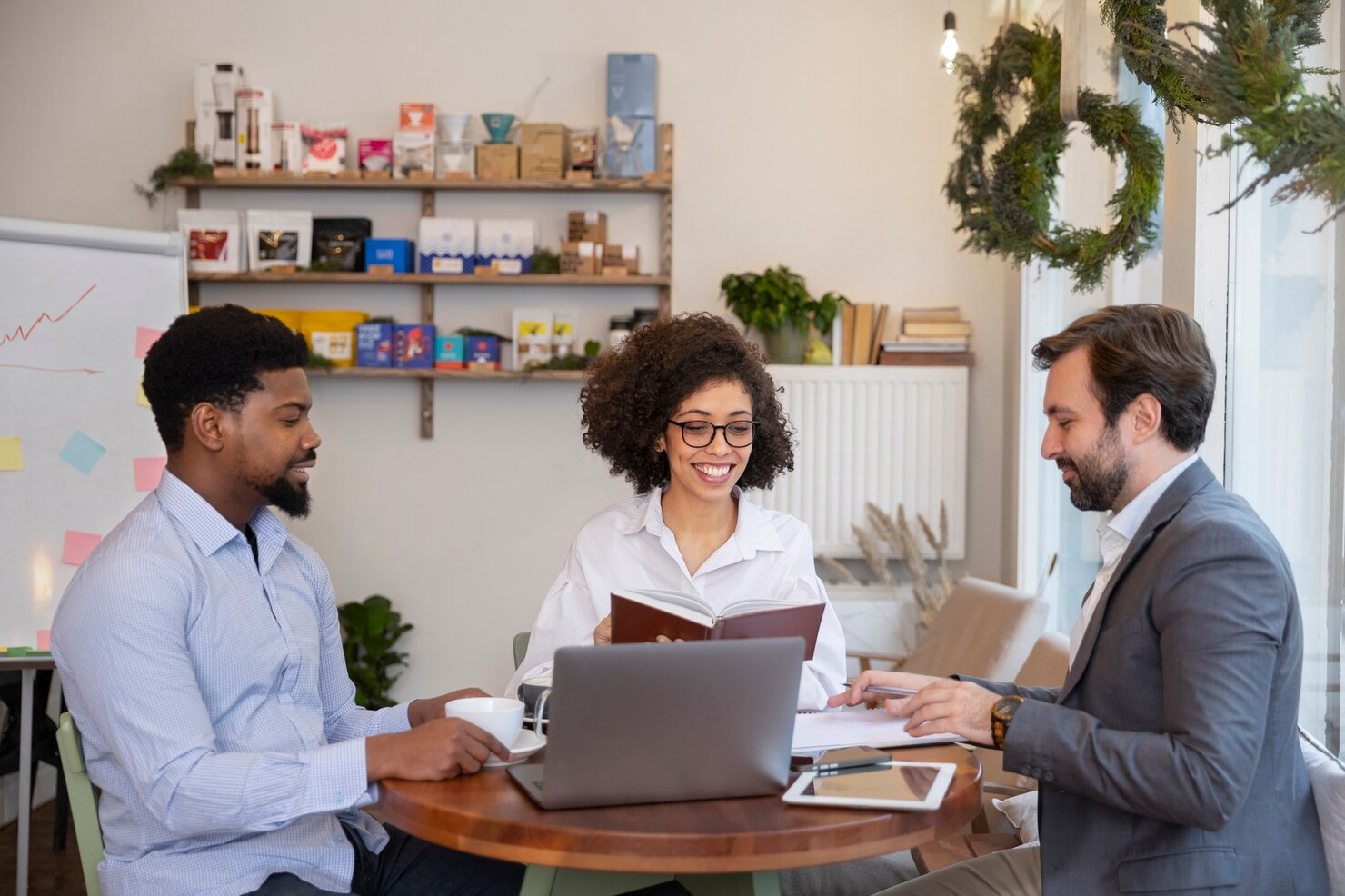 A team in a meeting building a recruitment plan