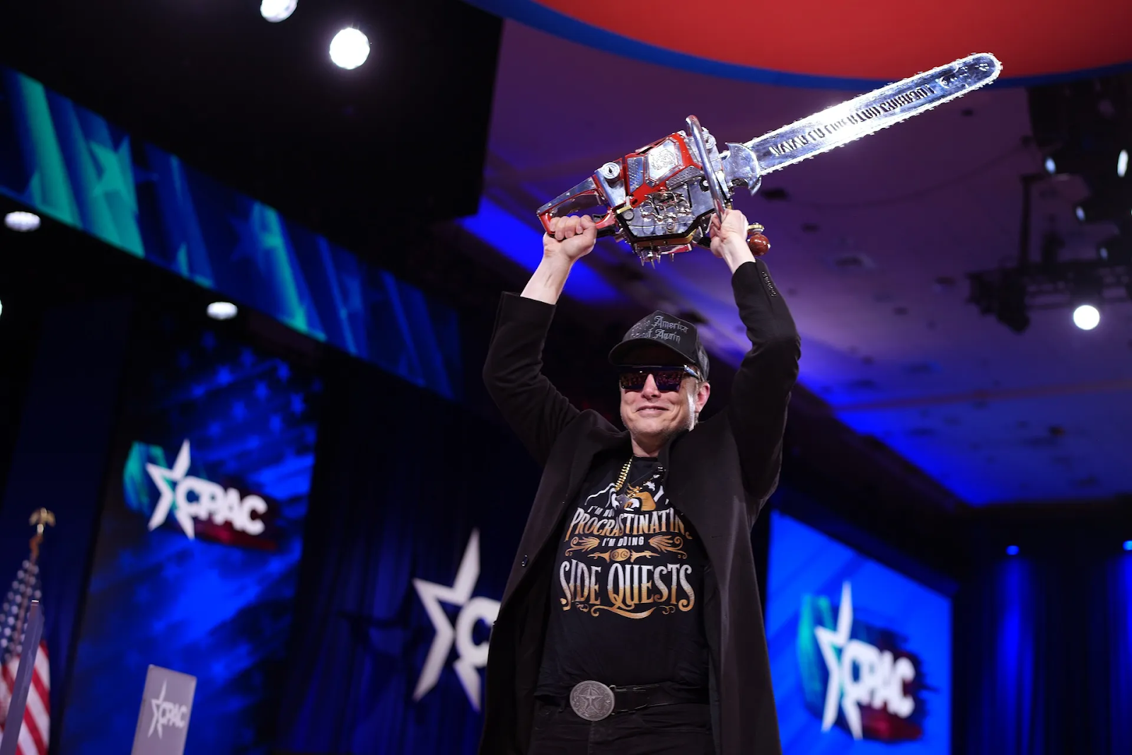 Elon Musk holding a chainsaw (DOGE)
Image Credits:
Andrew Harnik / Getty Images
