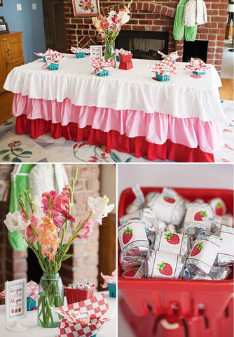 Table decorated for a strawberry-themed baby shower