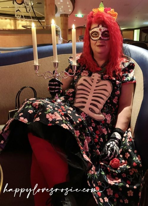 woman sitting dressed as a skeleton