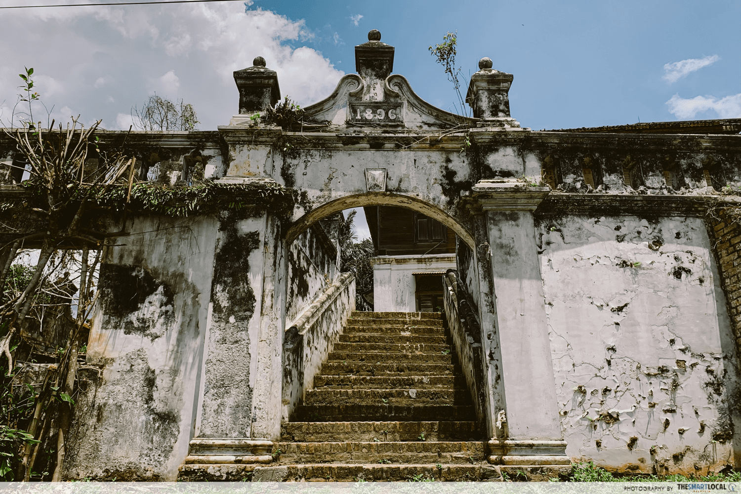 The mansion’s entrance with the year “1896” crowning its elaborate arch