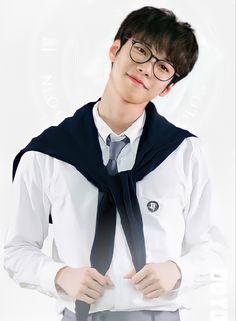 This contain Doyoung wearing glasses and a tie