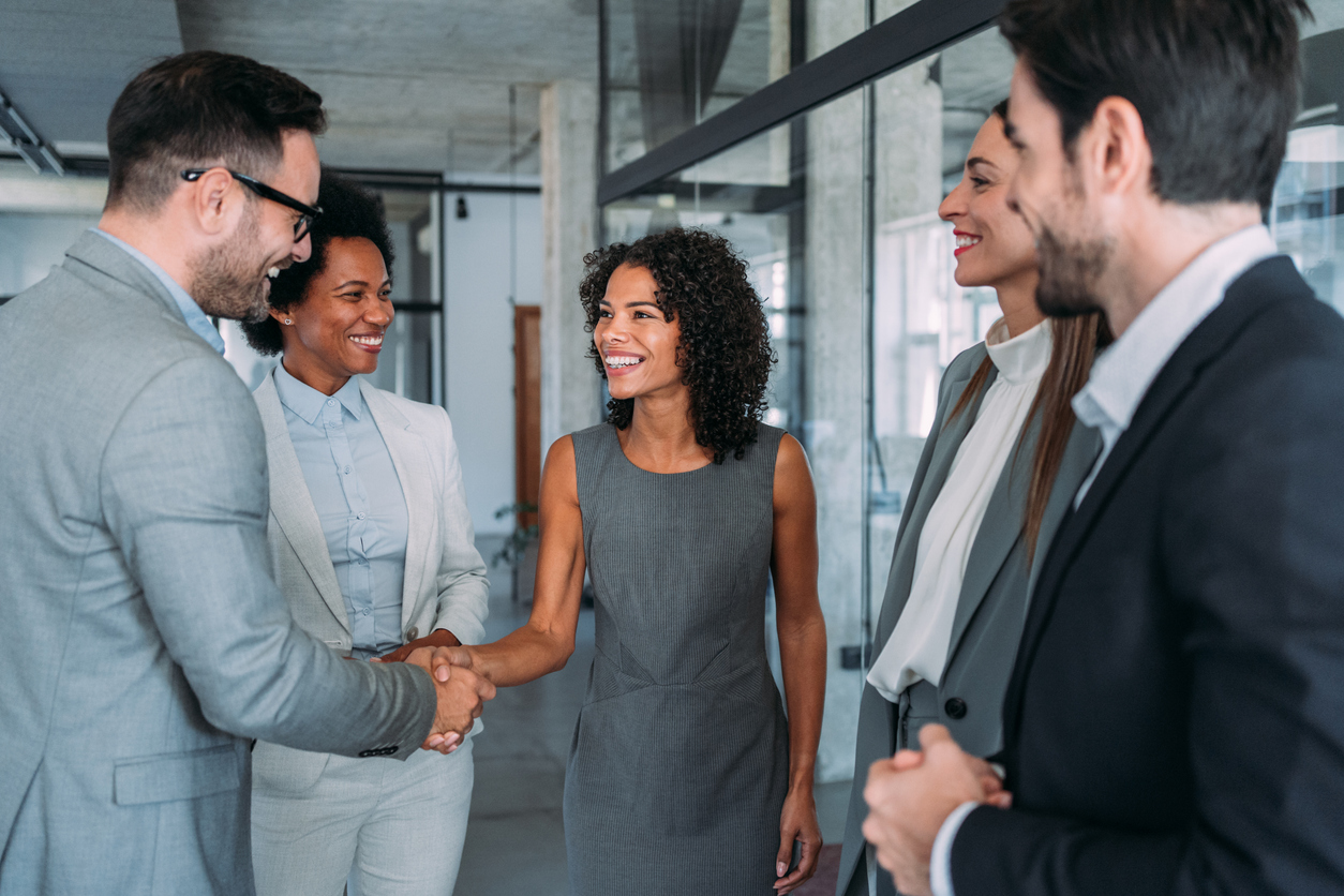 managers welcoming new employees as part of the employee engagement program