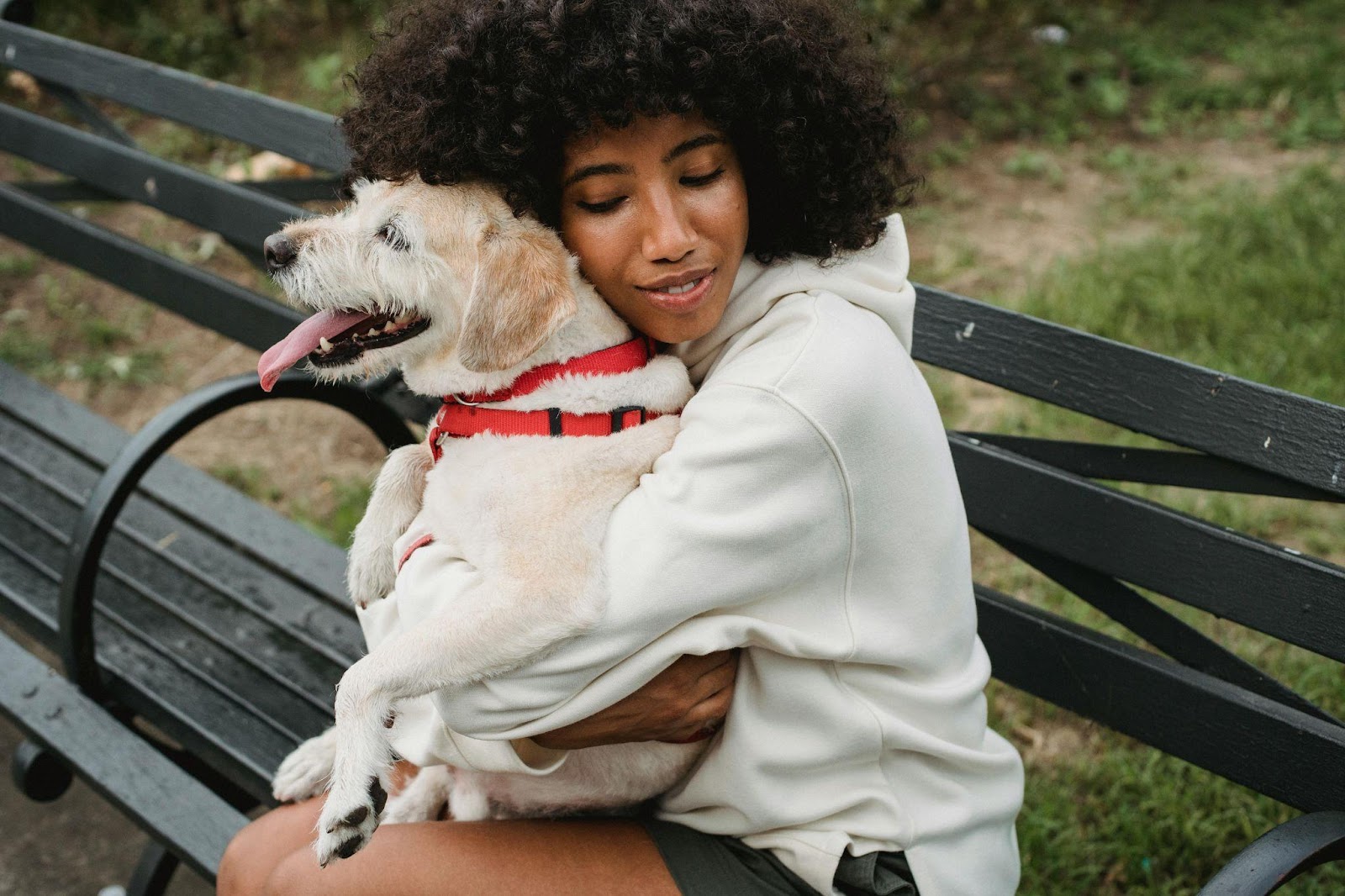 woman cuddling cute dog