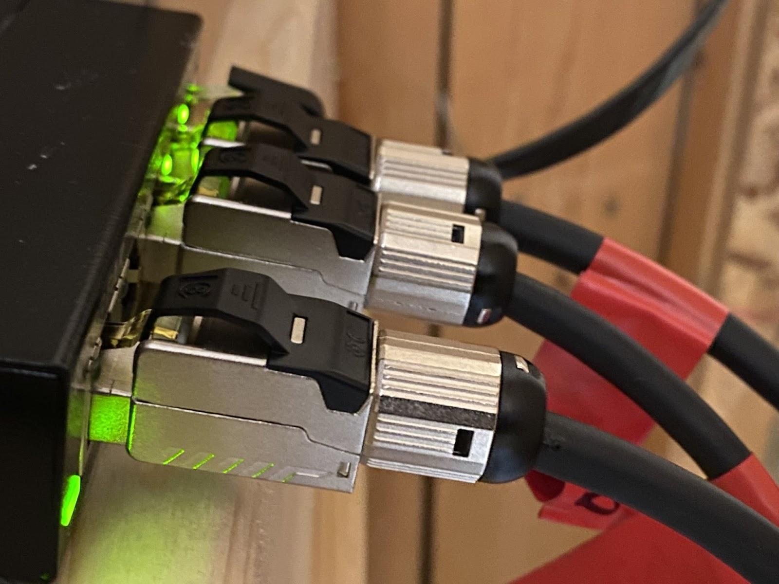 A group of Cat8 cables connected to a motherboard