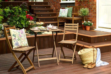 environmental benefits of choosing trex composite decking folding chairs in outdoor living space with stair riser lights and garden planter custom built michigan