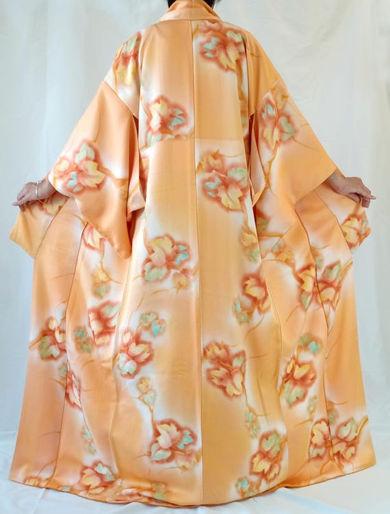 Orange kimono with autumn maple leaf patterns