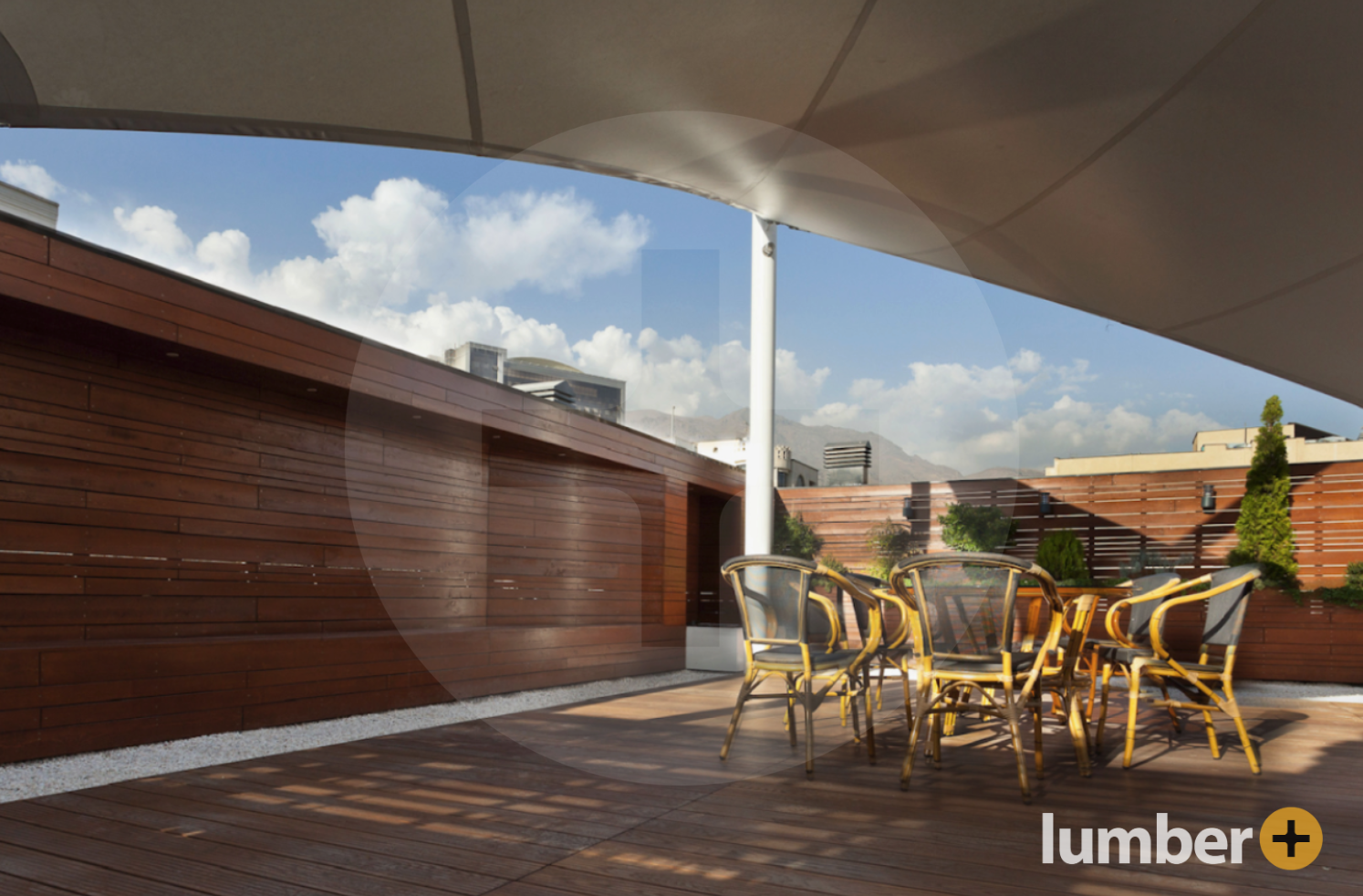 a patio surrounded by a building with wood cladding