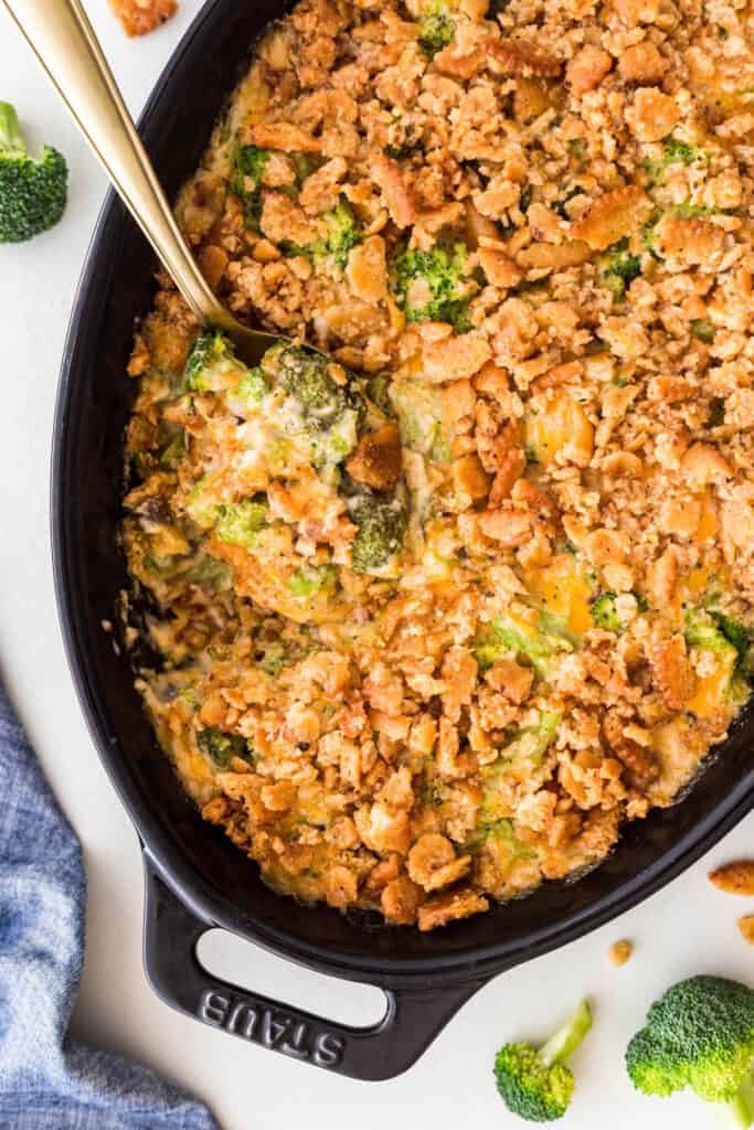 Cheesy Broccoli Casserole with a spoon in it. 