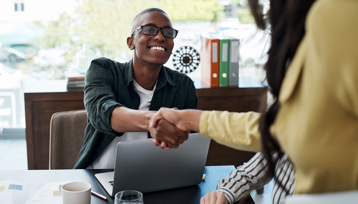 HR manager shaking hands with an employee