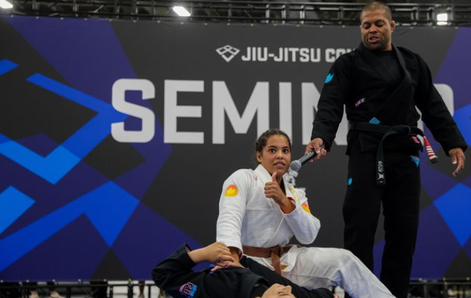 Sarah Galvao and me teaching the seminar at Jiu-Jitsu Con