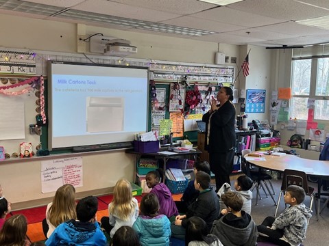 Third grade teacher in front of classroom giving math lesson at Kings Park Elementary School.