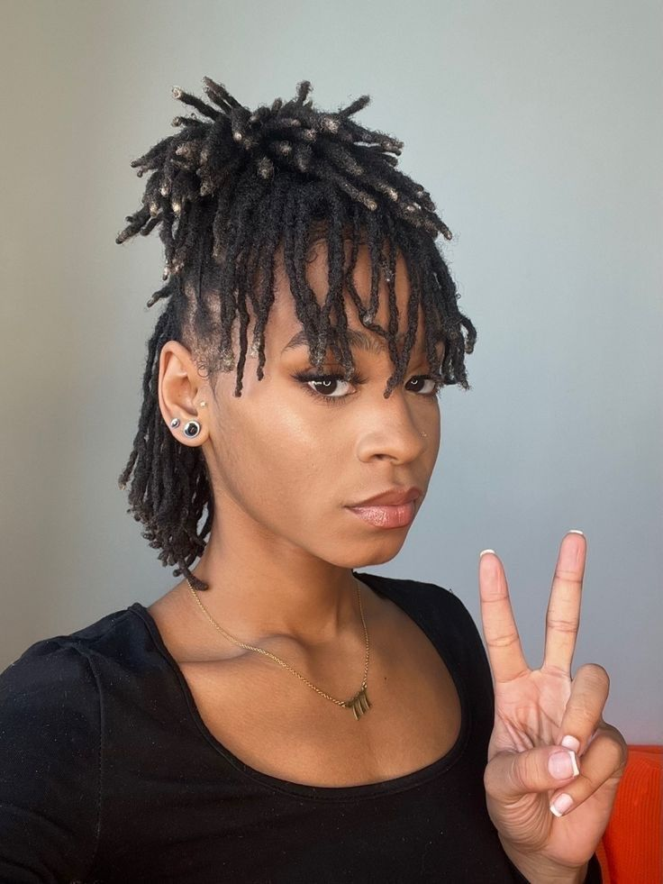 a lady rocking her locs hairdo