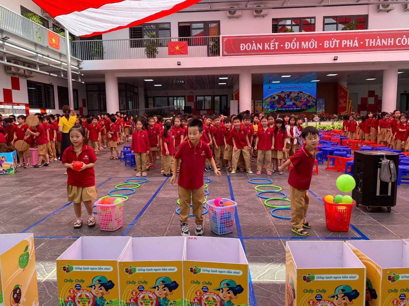 A group of children in red shirts

Description automatically generated