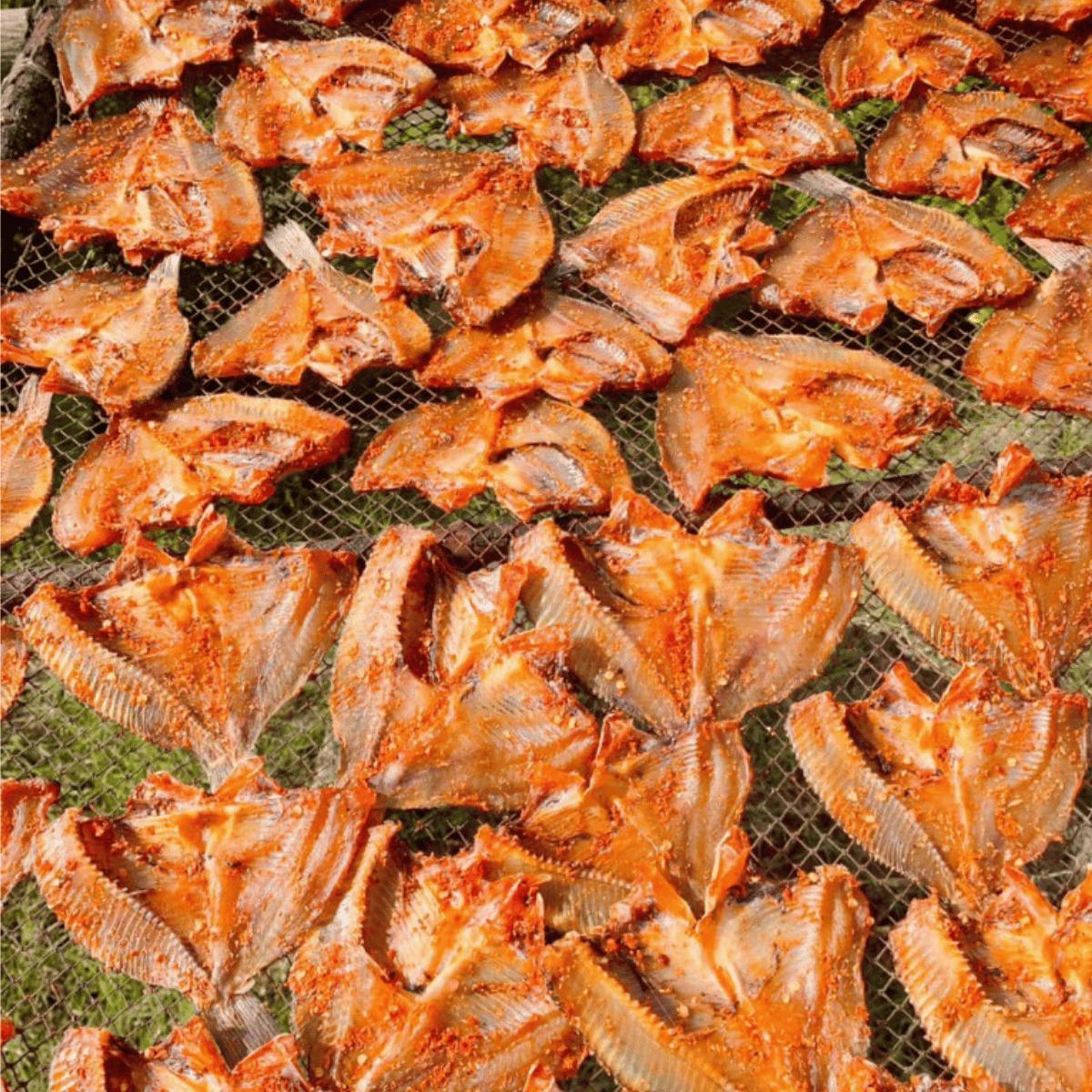 A group of dried fish

Description automatically generated