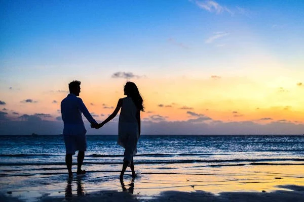 women and men on the beach