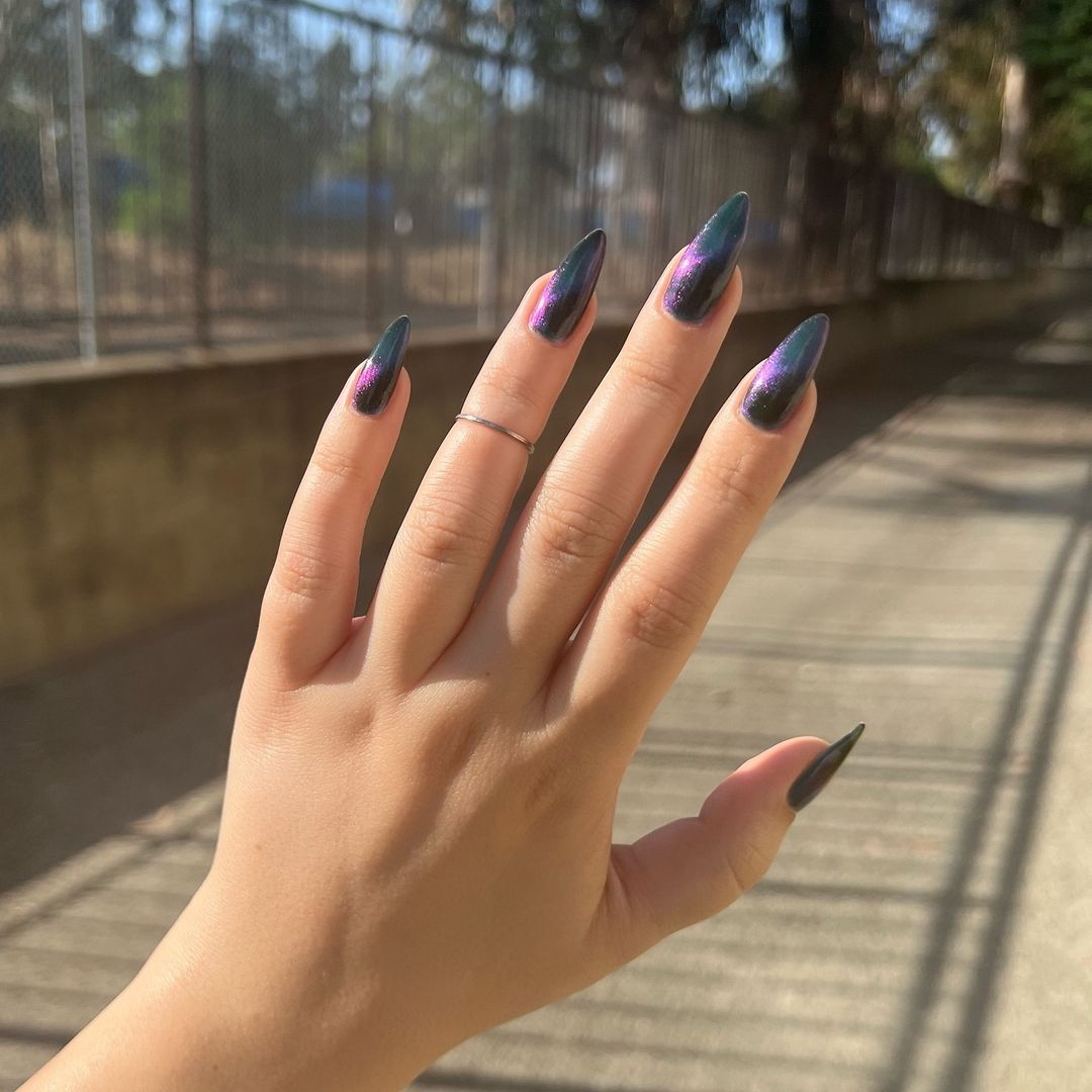 Close-up of hands with fall nail design having Magnetic Polish Effects