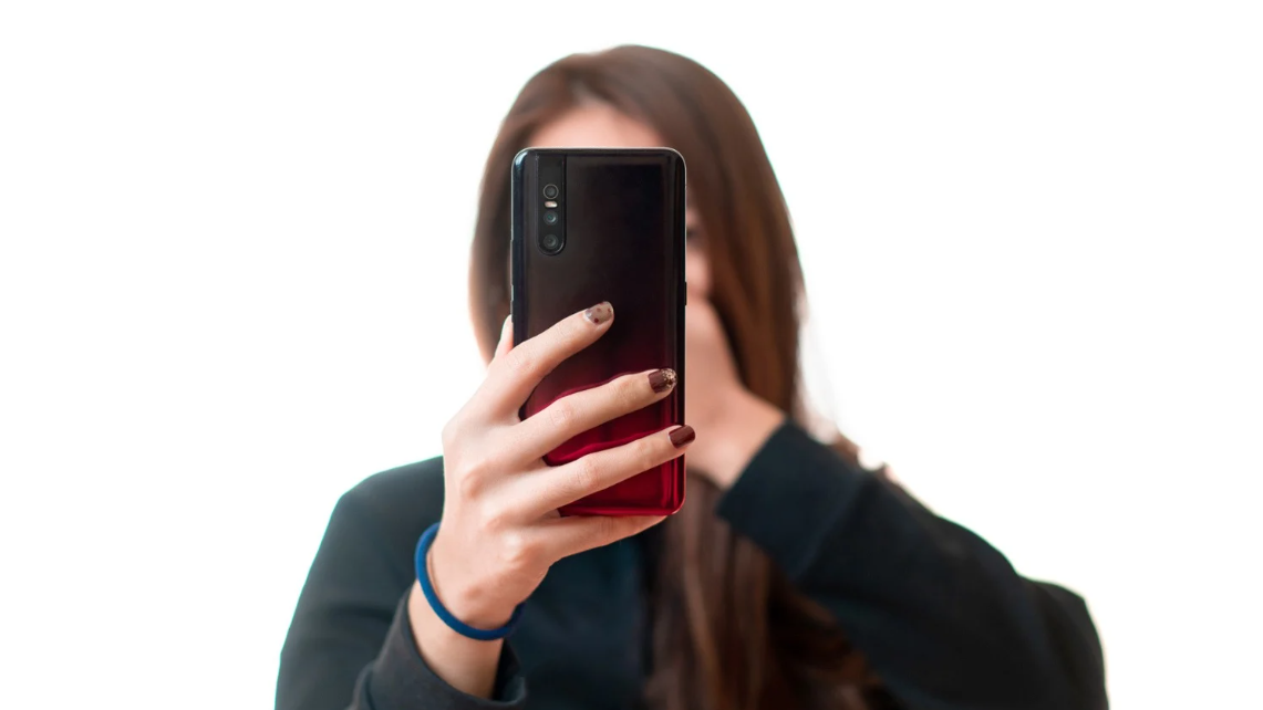 (Woman recording on her phone, representing civilian efforts to document police misconduct or protect civil rights.)