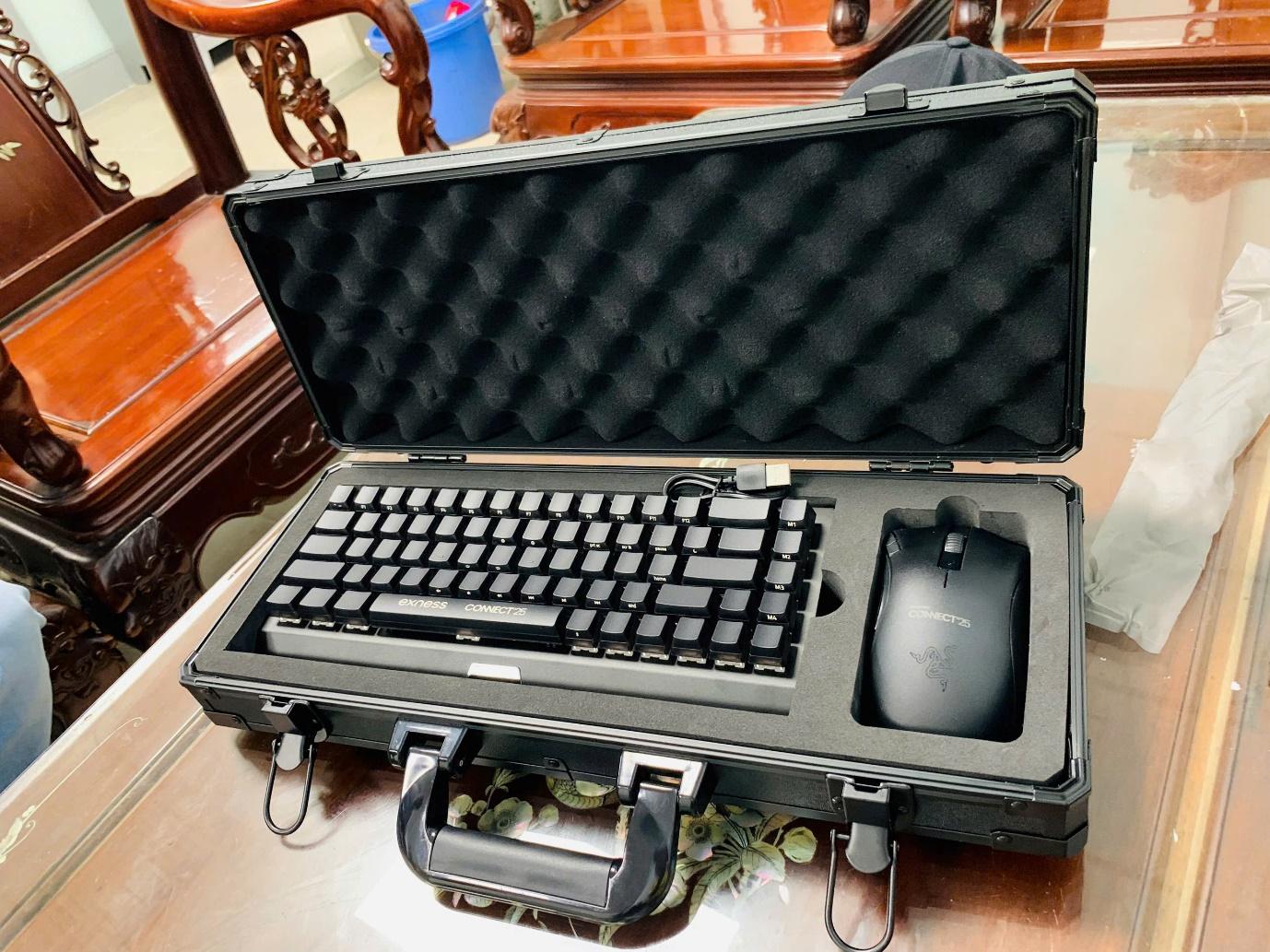A black case with a keyboard and mouseAI-generated content may be incorrect.