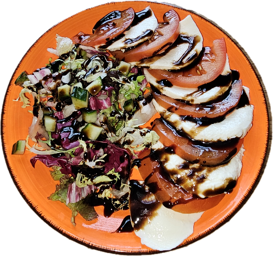 A plate of food on a black background

Description automatically generated