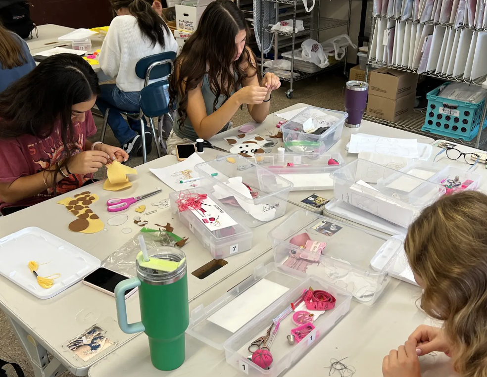 image of students learning to sew