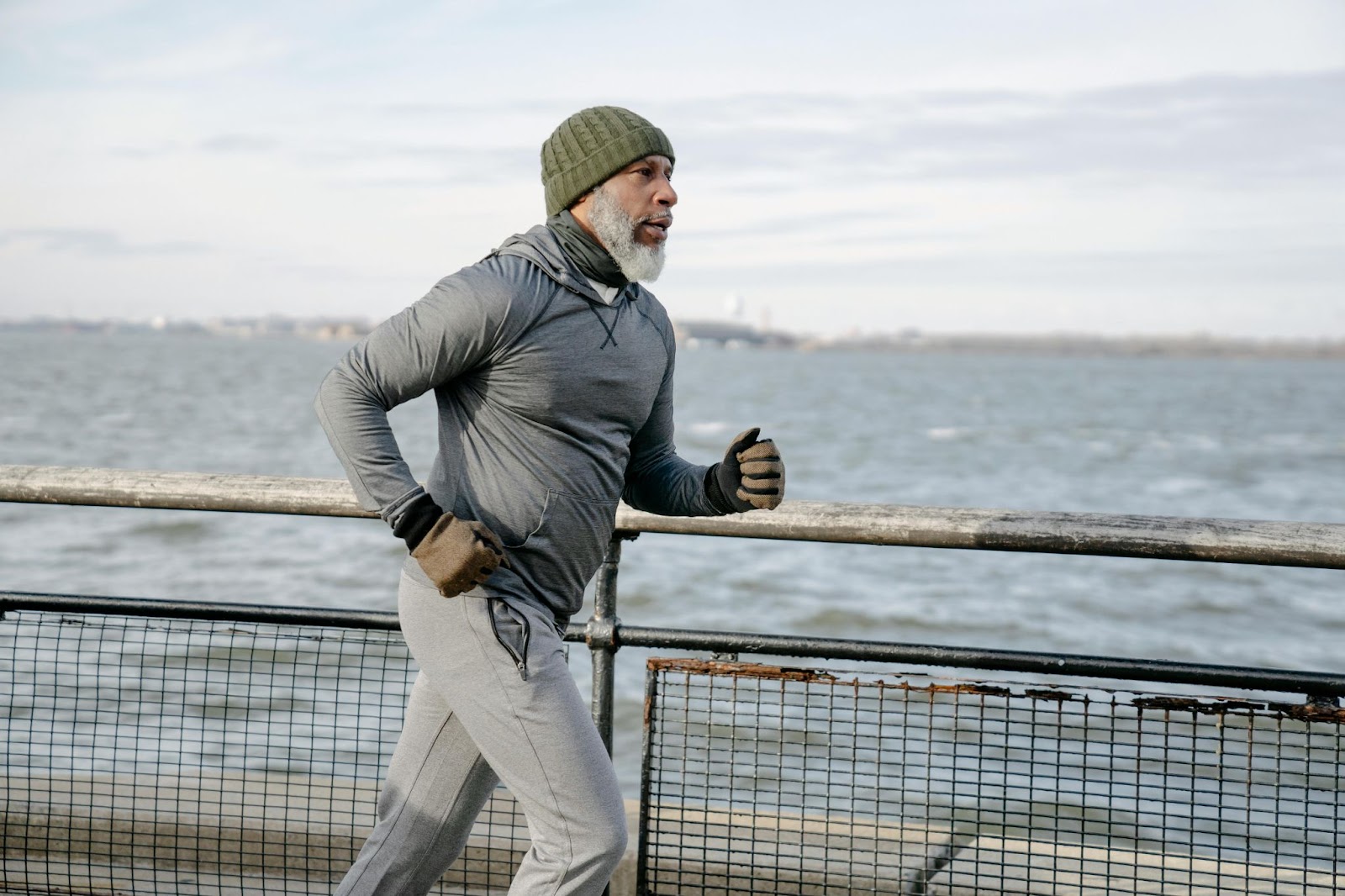 A man running by the ocean