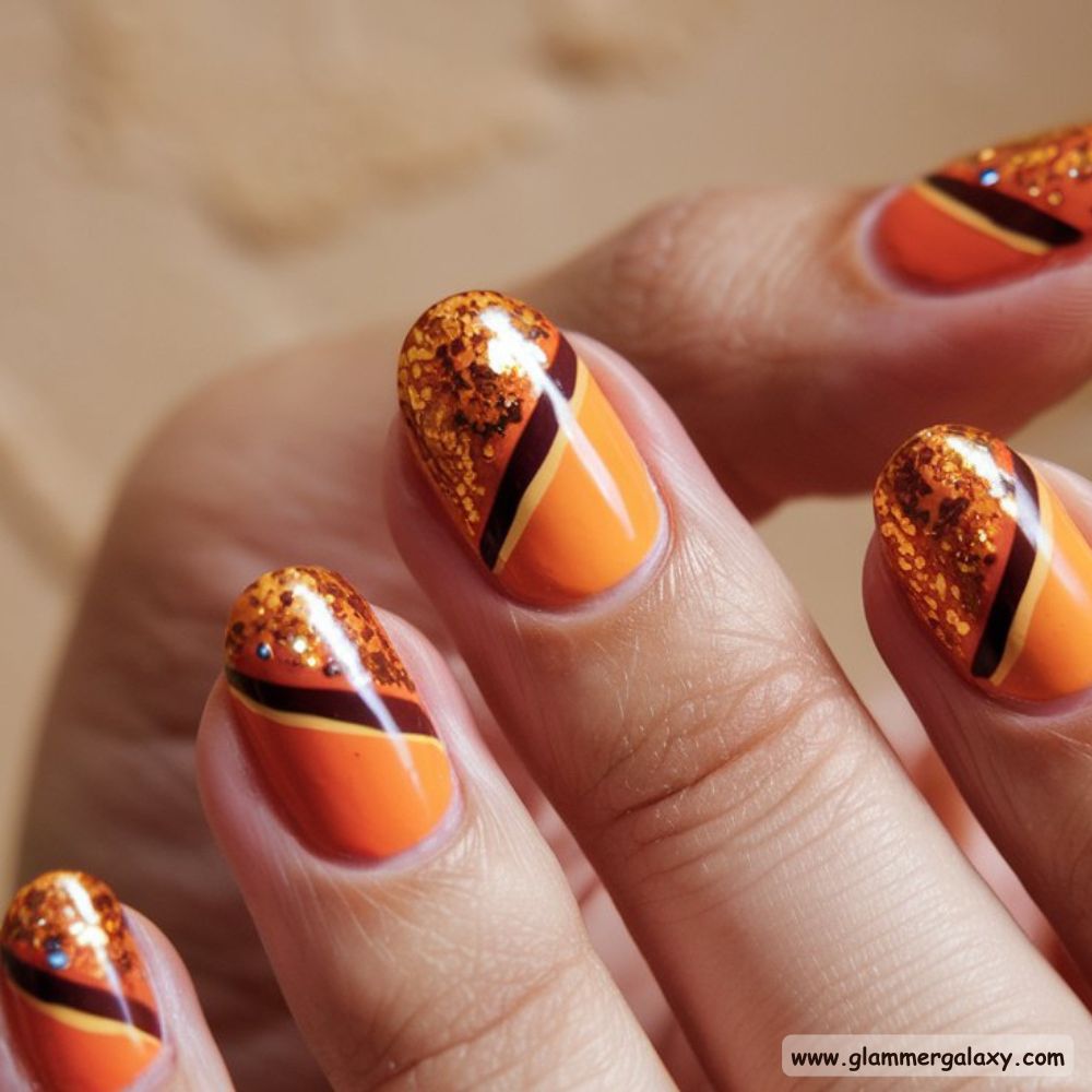 Classy Winter Nails having Vibrant Orange Accents for Winter
