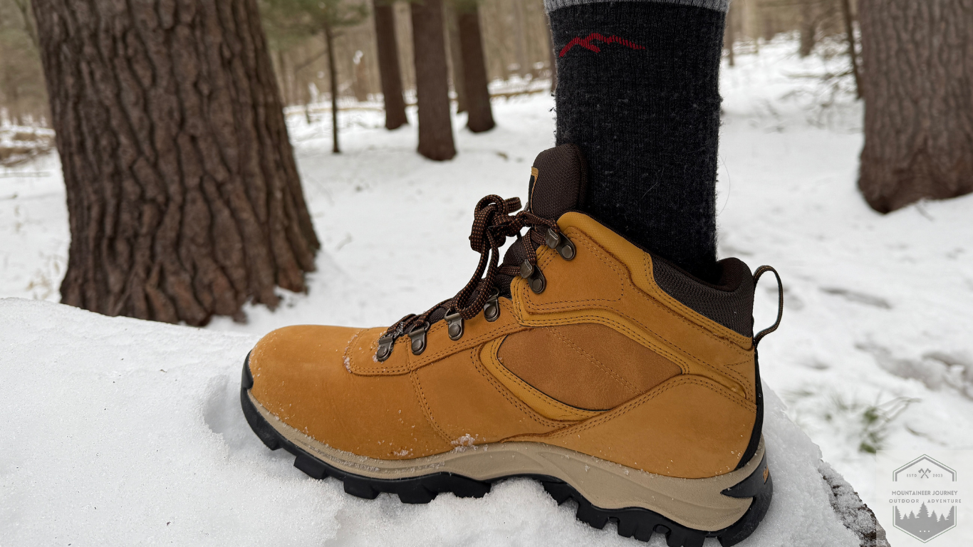 Entire Side View Of Timberland Mt Maddsen resting on a rock surrounded wit h snow