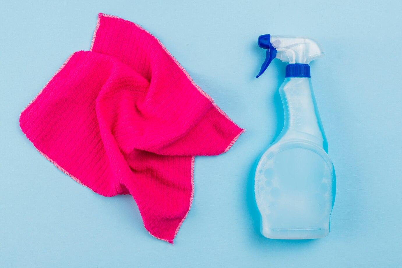 Image of a rag and a spray bottle