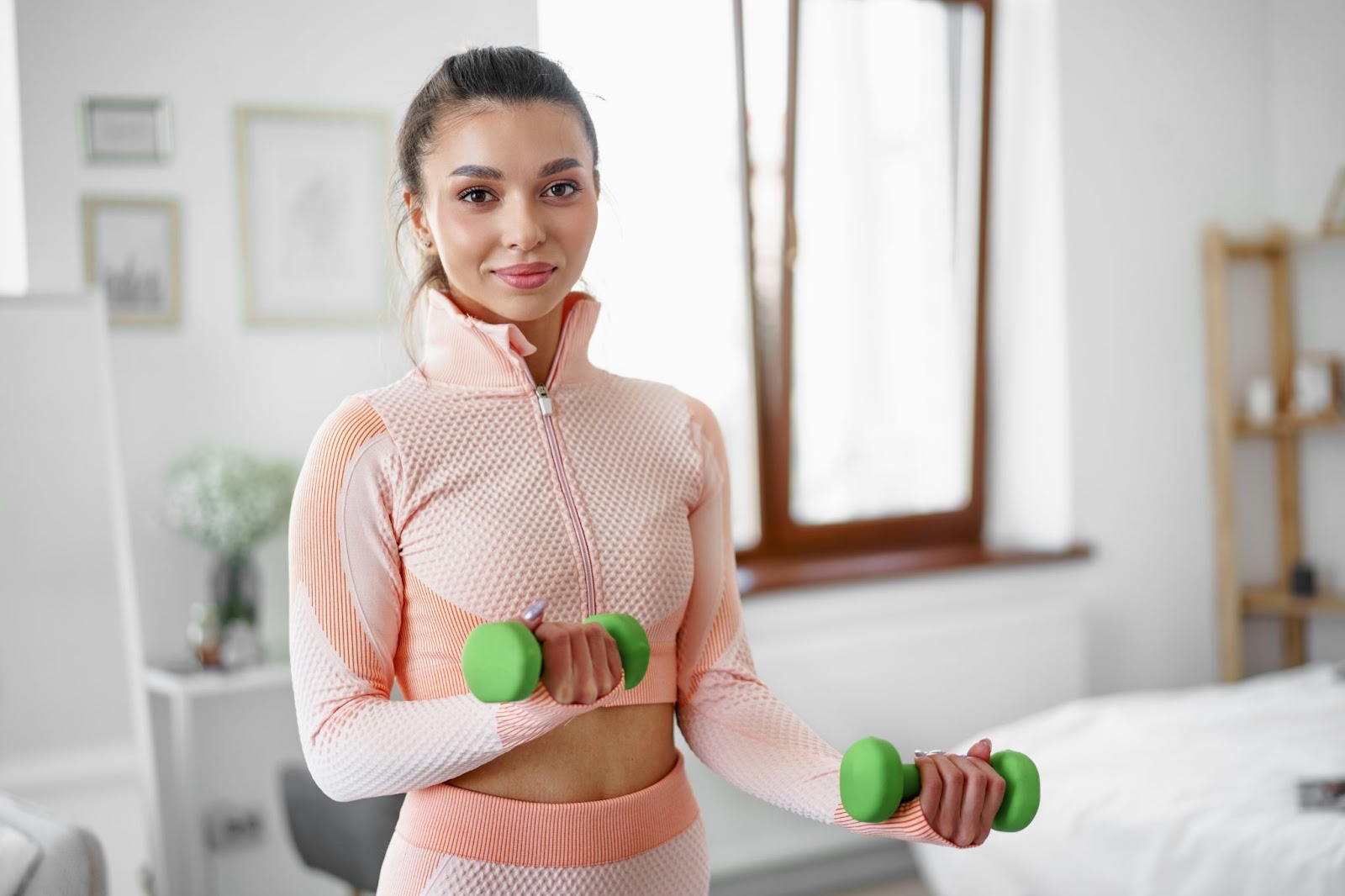 Sport young woman performing home workout routine.