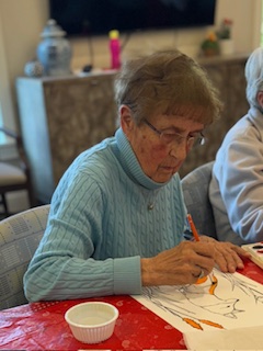 Woman painting with watercolors