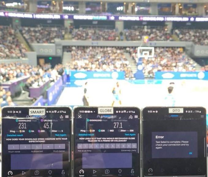 A row of cell phones in front of a stadium

Description automatically generated