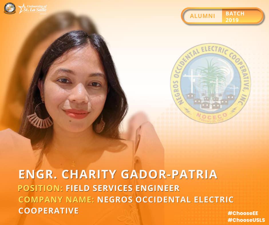 A person smiling with an orange backgroundDescription automatically generated