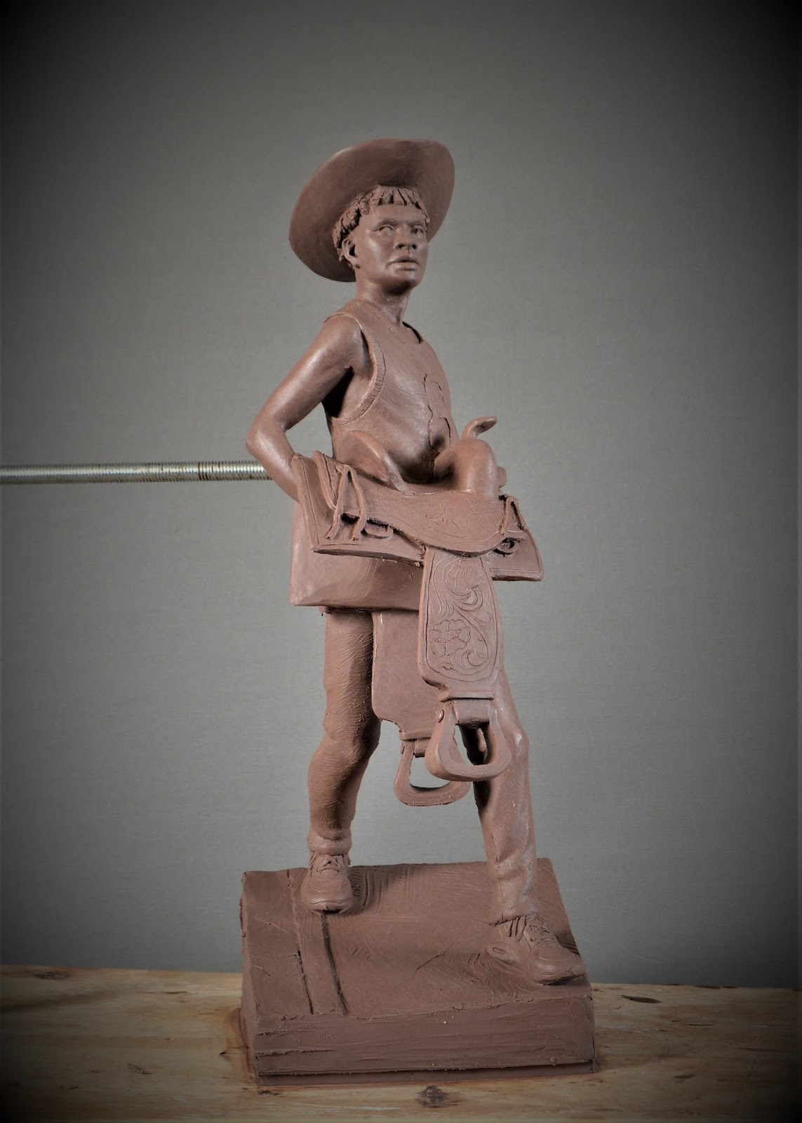 A statue of a naked child

Description automatically generated with low confidence