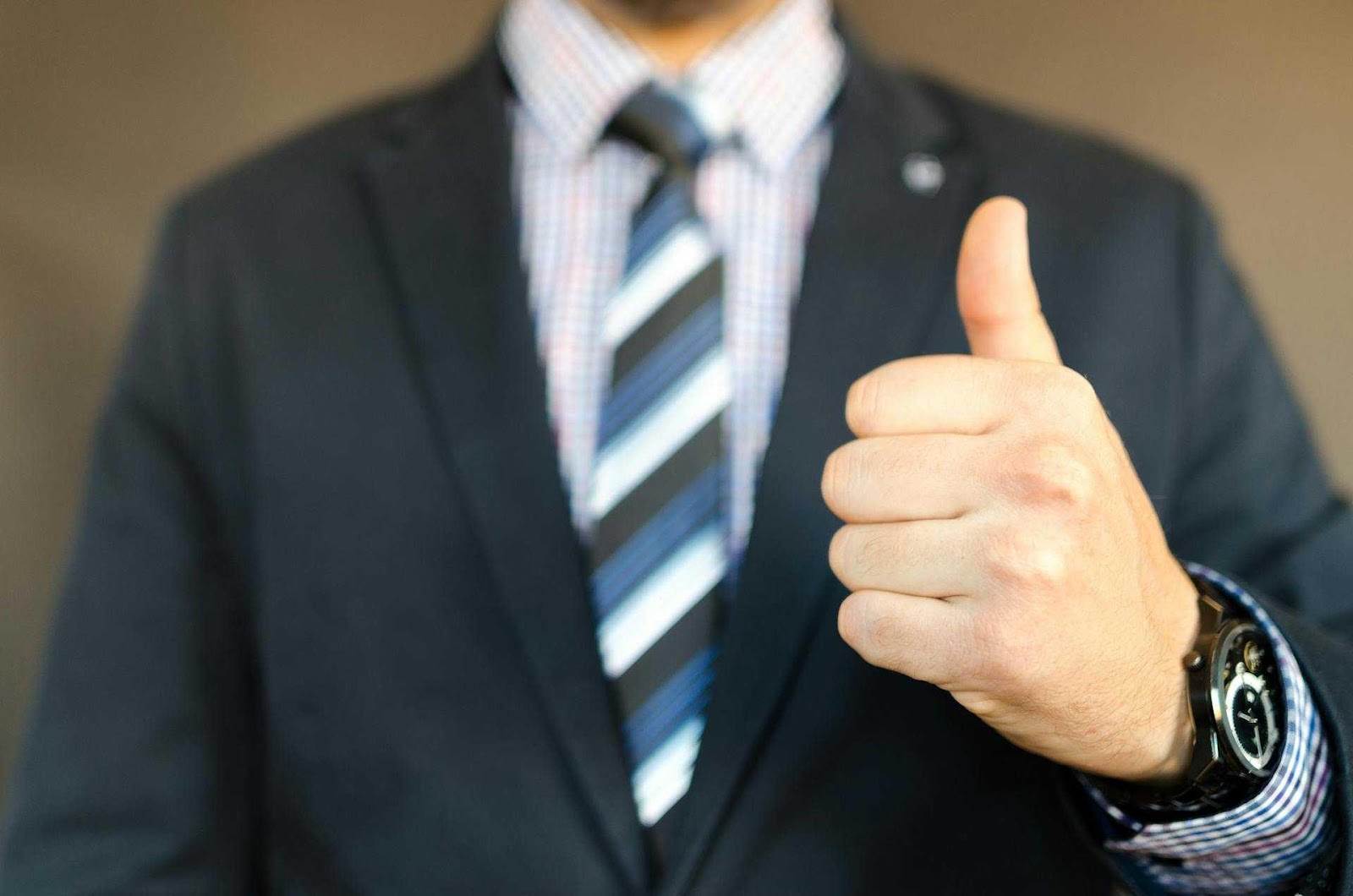 A man giving a thumbs-up.
