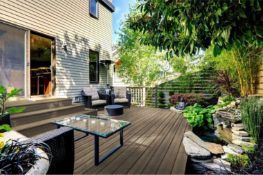 combining hardscaping and decking for a unique outdoor living space deck with stone zen garden custom built michigan