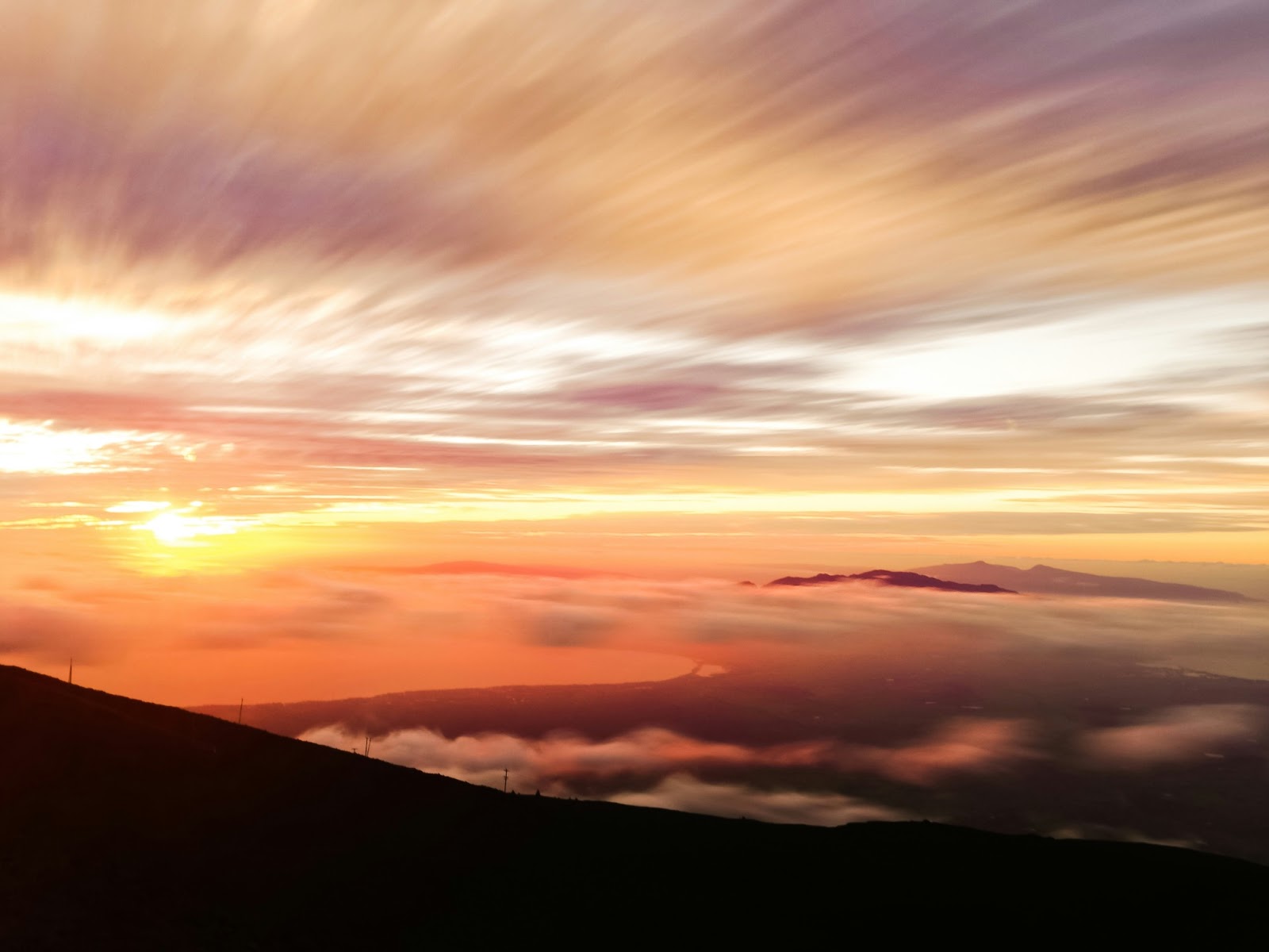 Haleakalā sunrise above the clouds, offering breathtaking views of Maui.