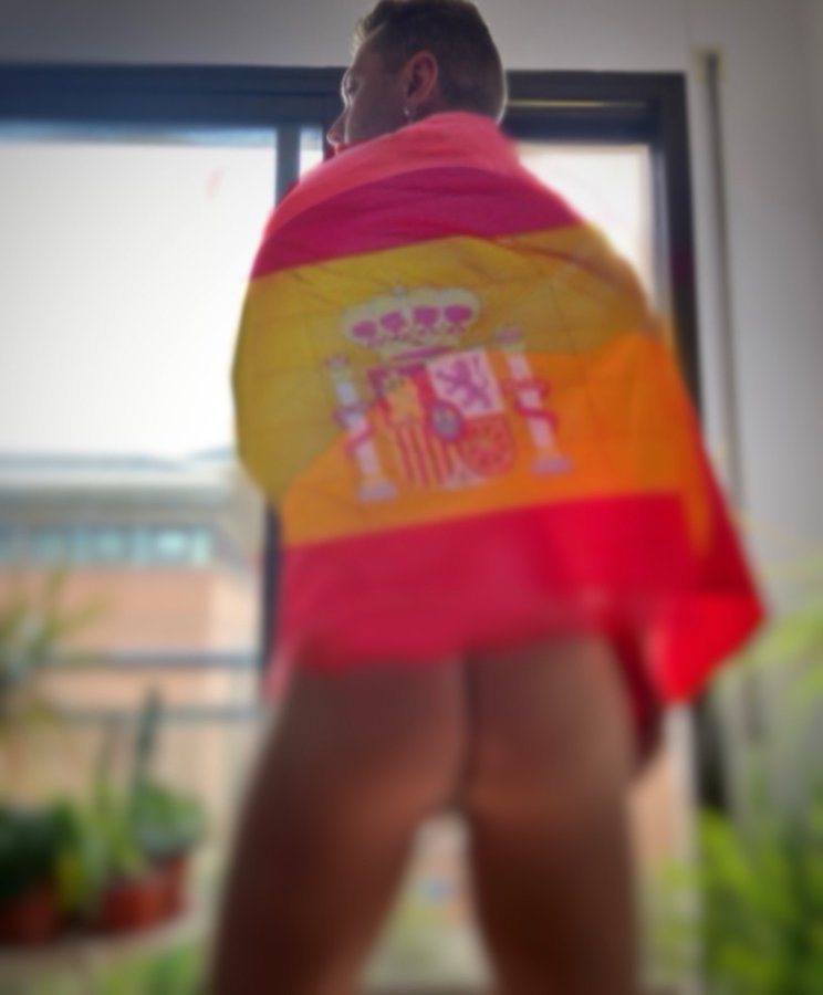 gay xxx porn creator Mars Barcelona posing in a country flag naked showing off his gay bubble butt