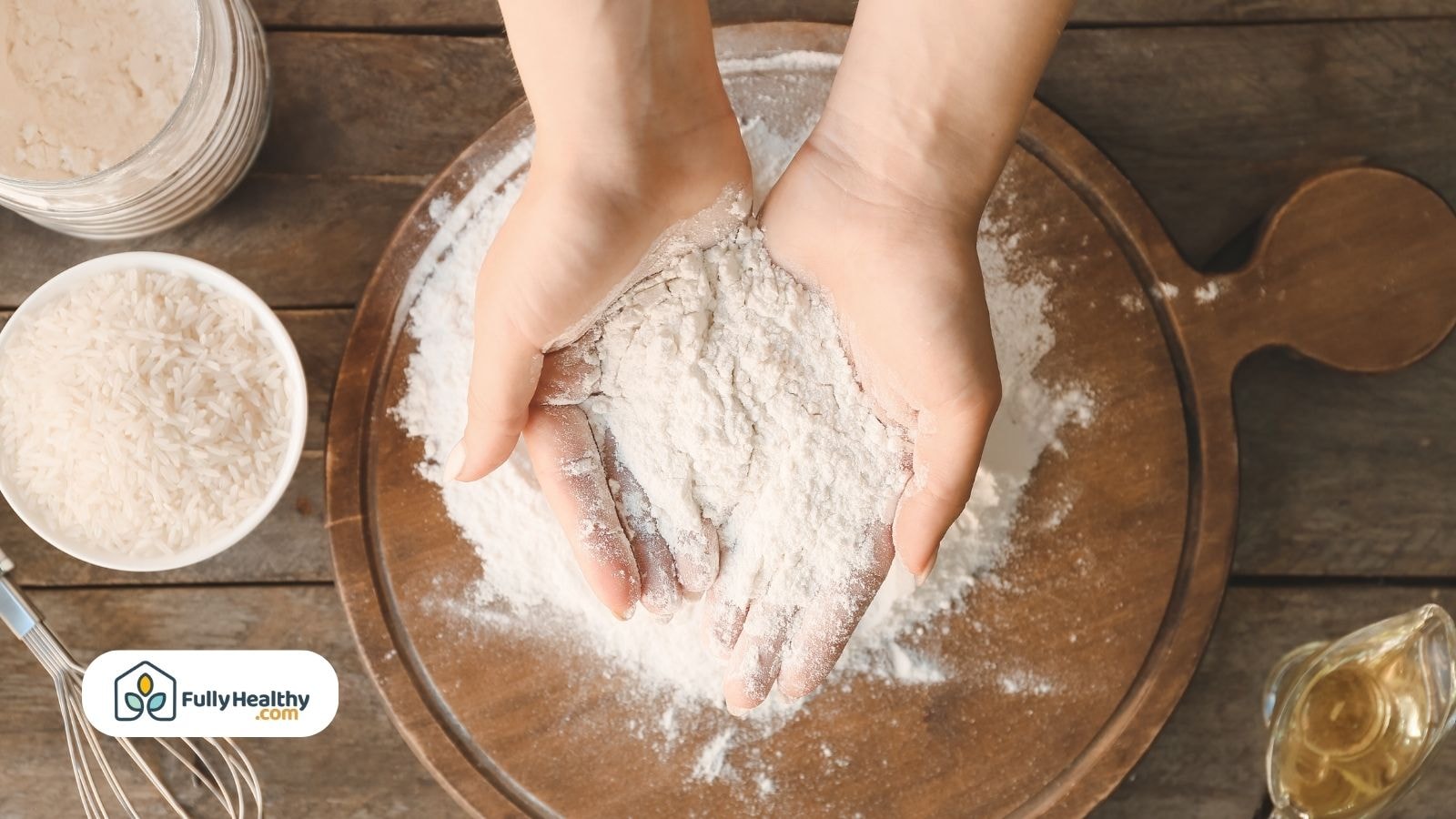 Hands holding fresh flour above wooden board
