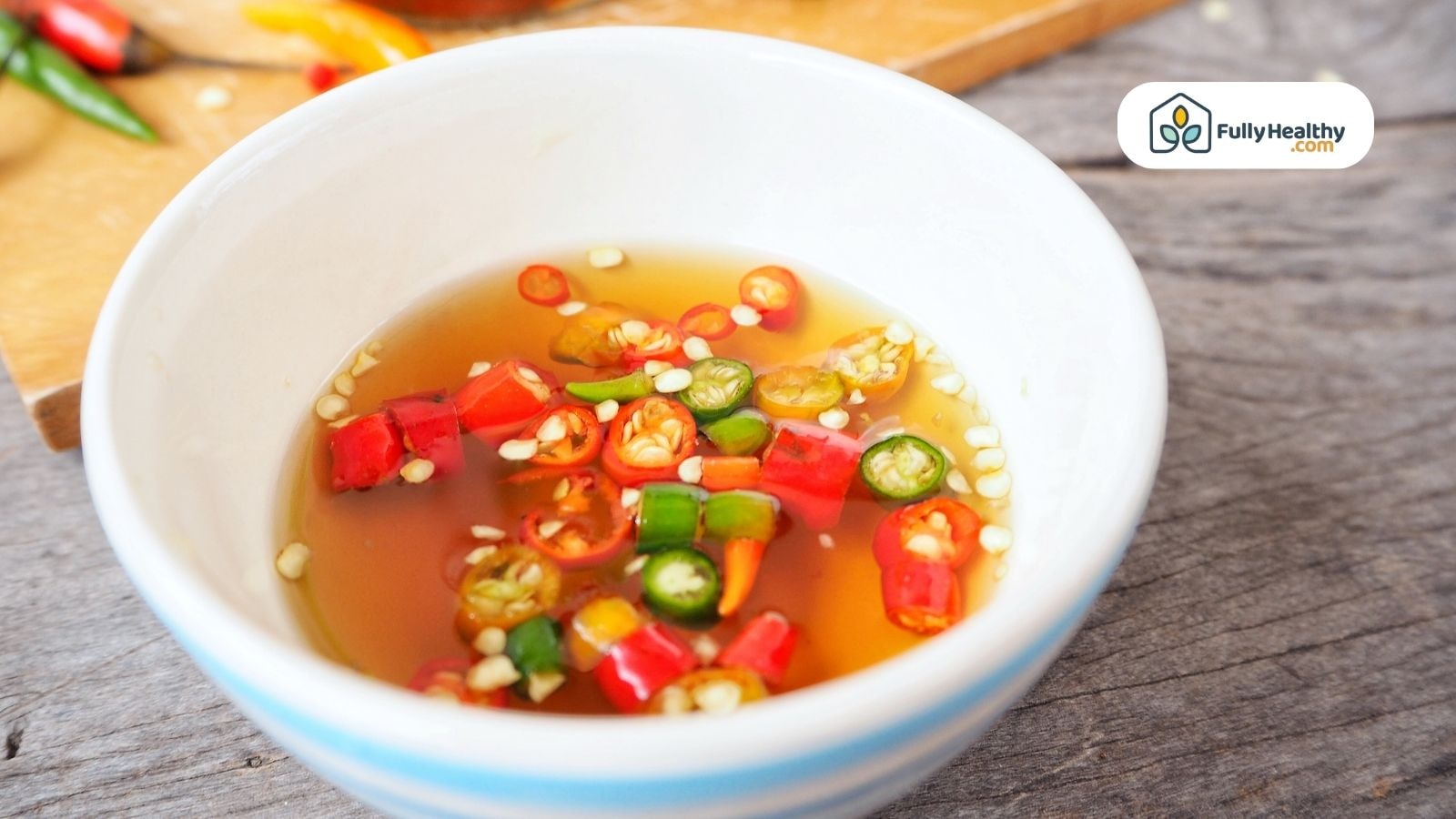 Thai fish sauce with chopped red and green chili peppers