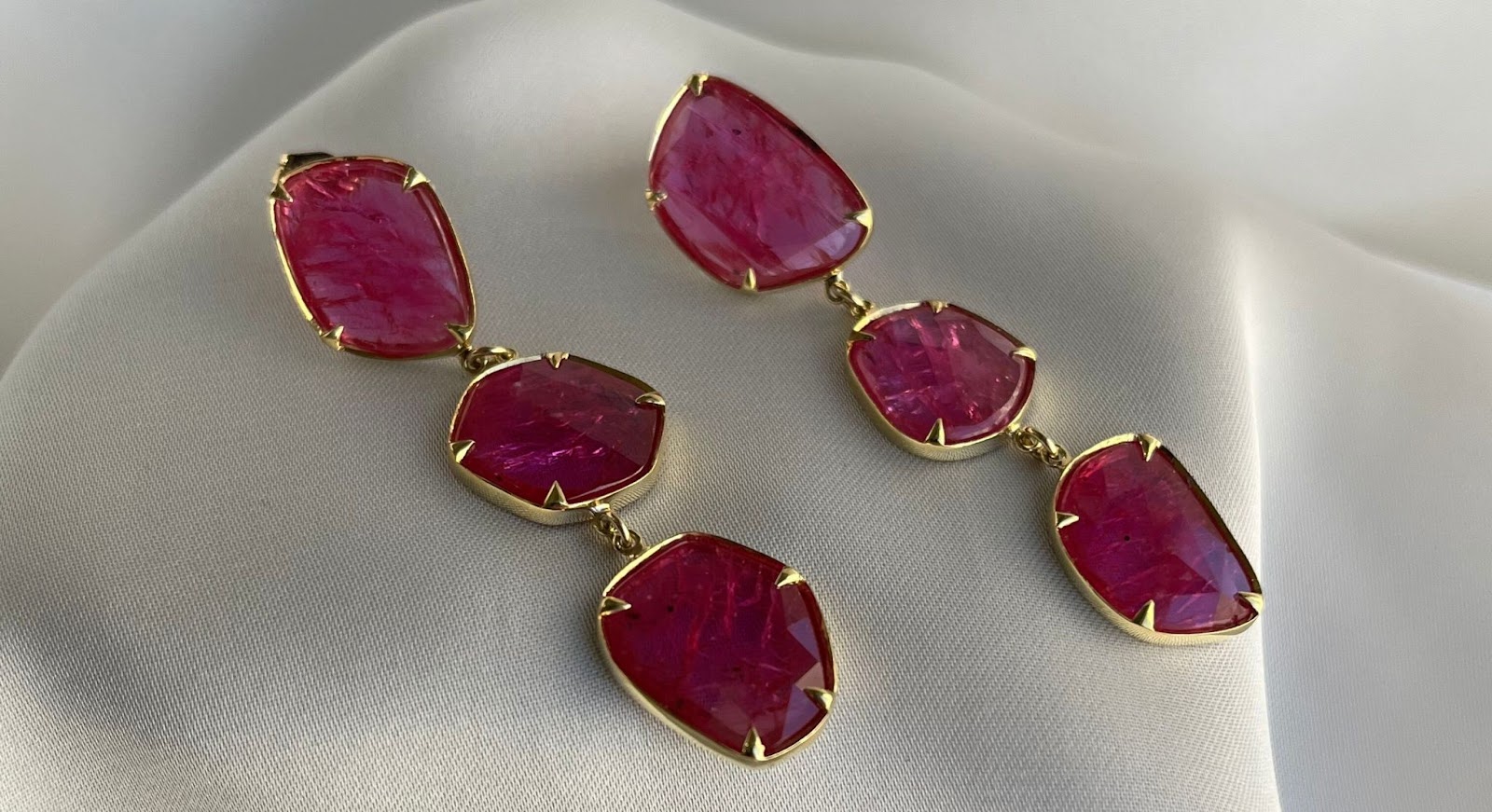 Elegant Ruby dangle earrings, perfect for formal wedding attire.